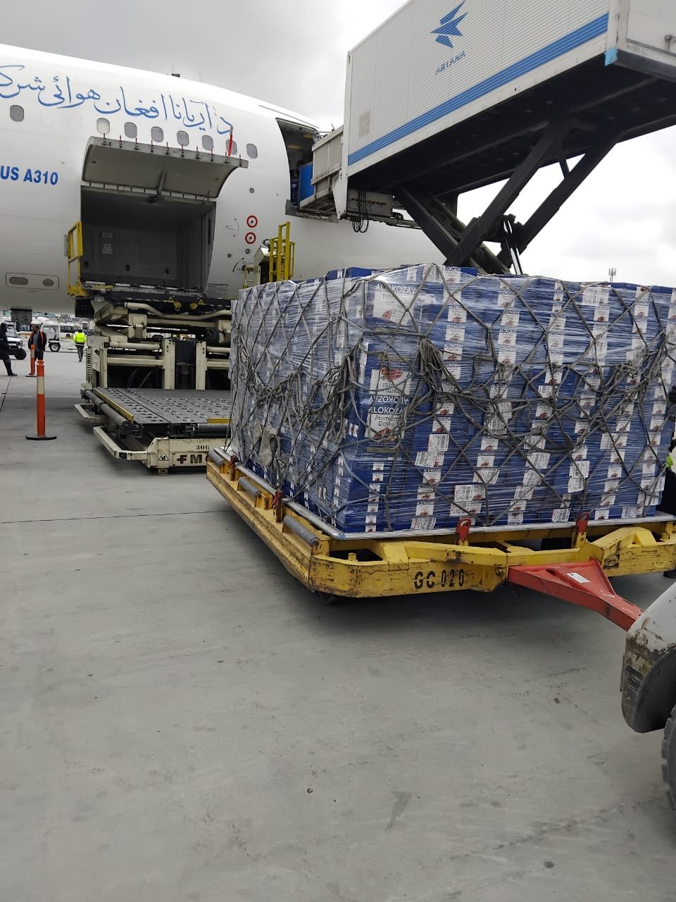 A truck loaded with sacks